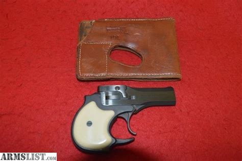 22 SHORT WITH GOLD FINISH AND PEARL GRIPS. . High standard 22 magnum derringer wallet holster